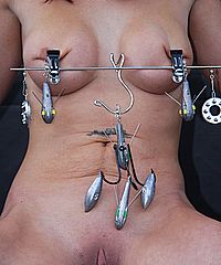 Busty slave girl Daniis outdoor bdsm and public punishment in disgraceful tit torture from The Pain Files